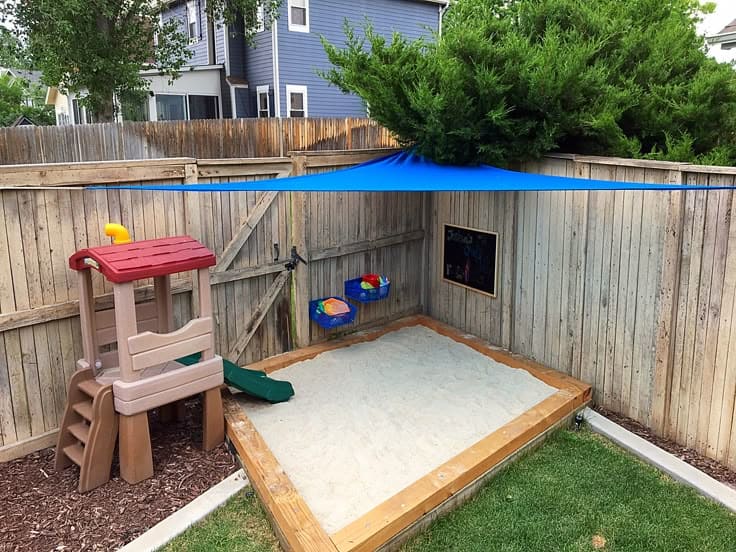 Cozy Backyard Sandbox with Sunshade